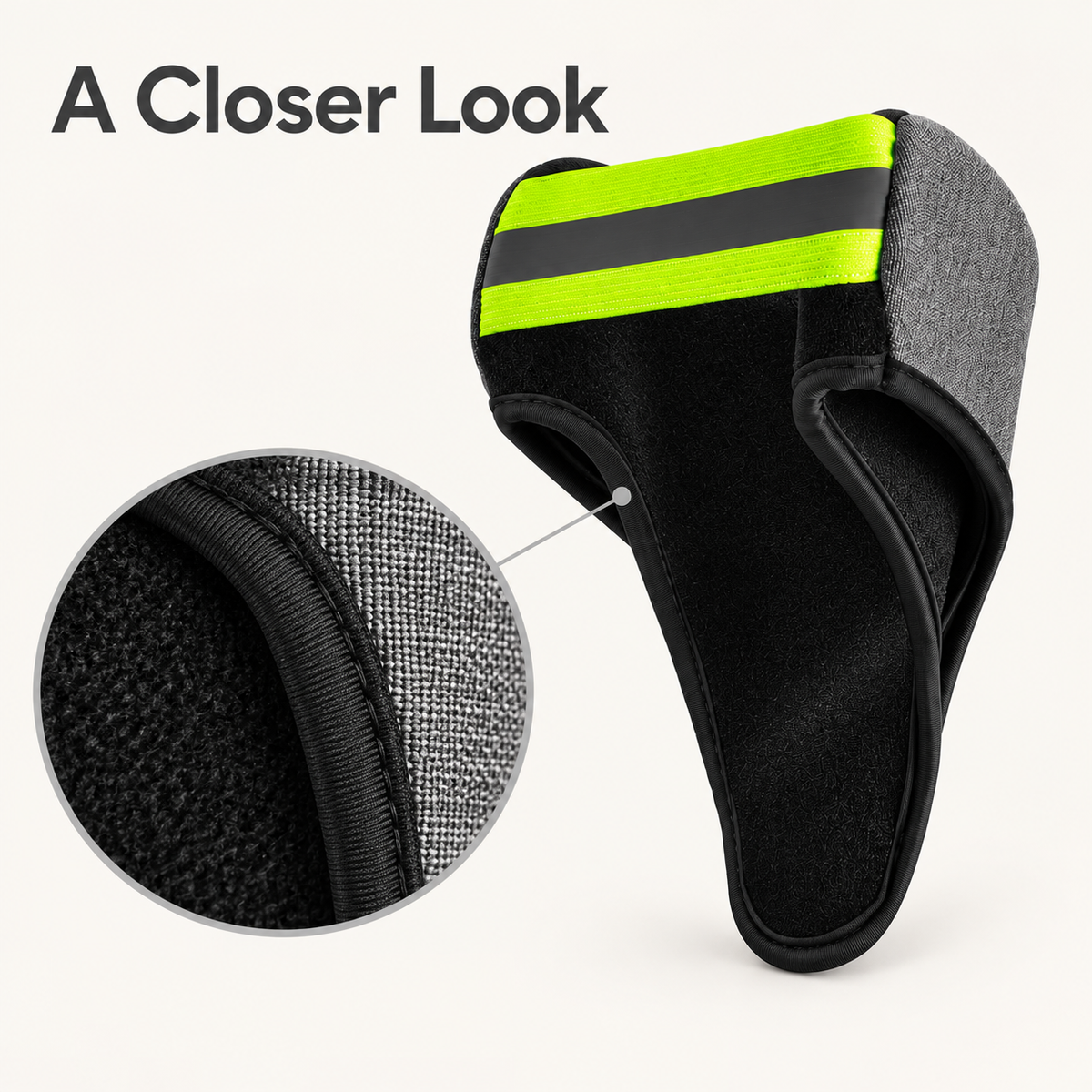 Close-up of the DeepTireh DT-A016 cuff cover showing gray outer fabric, black lining, edge trim, and yellow-green accents.