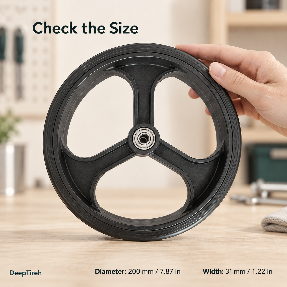 Black three-spoke wheel labeled with a diameter of 200 mm (7.87 in) and a width of 31 mm (1.22 in).