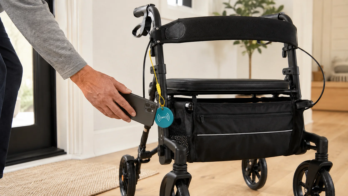 Person holding a smartphone near an NFC tag attached to a black rollator walker with seat and storage bag.