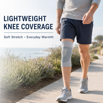 Man walking outdoors wearing grey knee sleeve for everyday warmth and lightweight support
