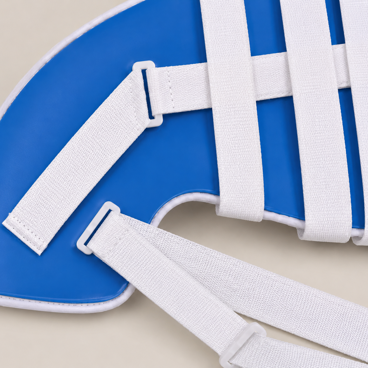Close-up of the white woven straps, stitching, and adjustment hardware on the DeepTireh DT-A005 shoulder brace