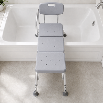 Top view of the transfer bench straddling a bathtub wall with two seat sections inside the tub