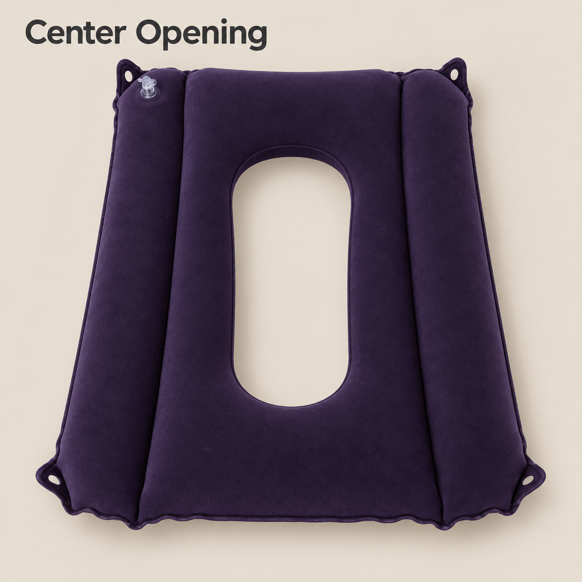 Top view of the inflatable commode cushion showing its elongated center opening and two raised side chambers.