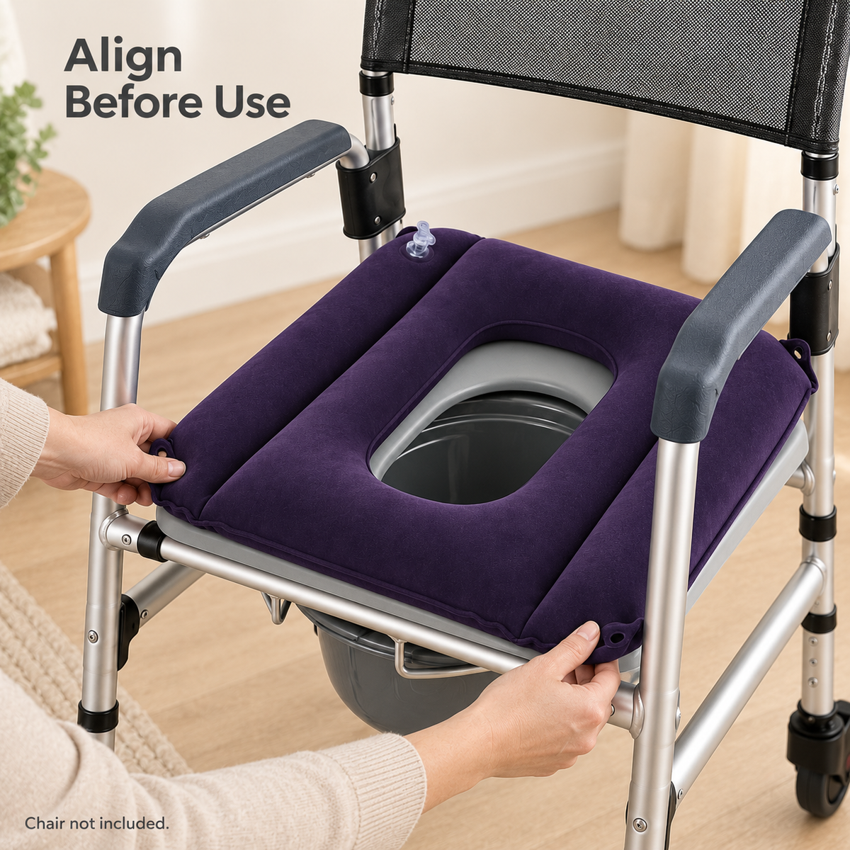 Hands positioning the inflatable cushion on a rolling commode chair to align the seat openings; chair not included.