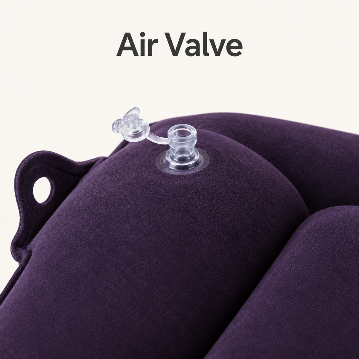 Close-up of the cushion's transparent air valve with its attached stopper open.