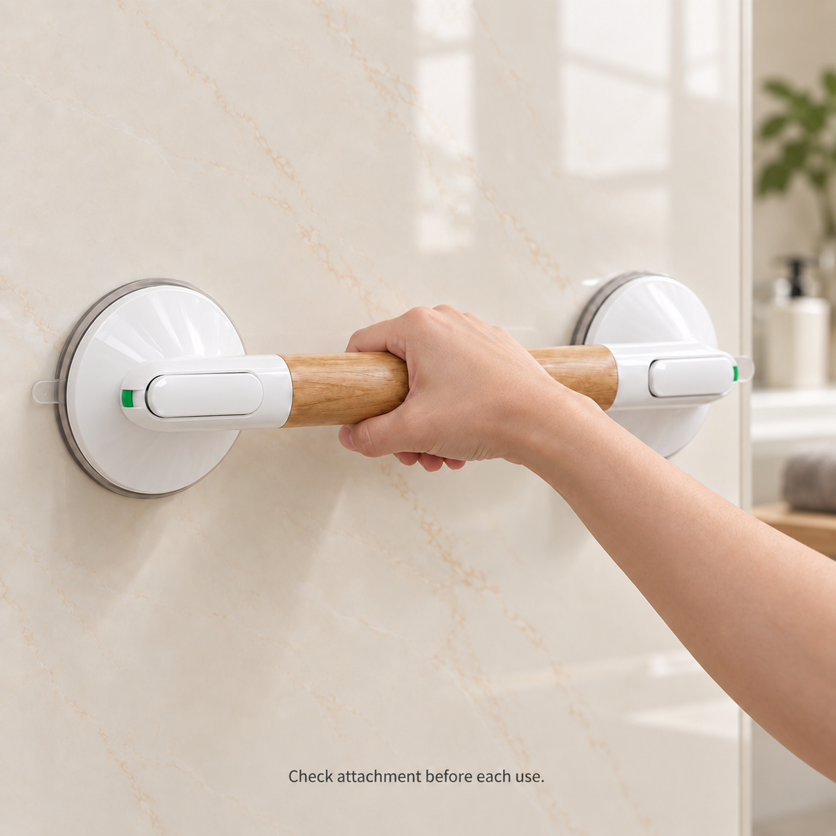 Close-up of a hand holding the woodgrain grip of a white suction handle mounted on smooth tile.